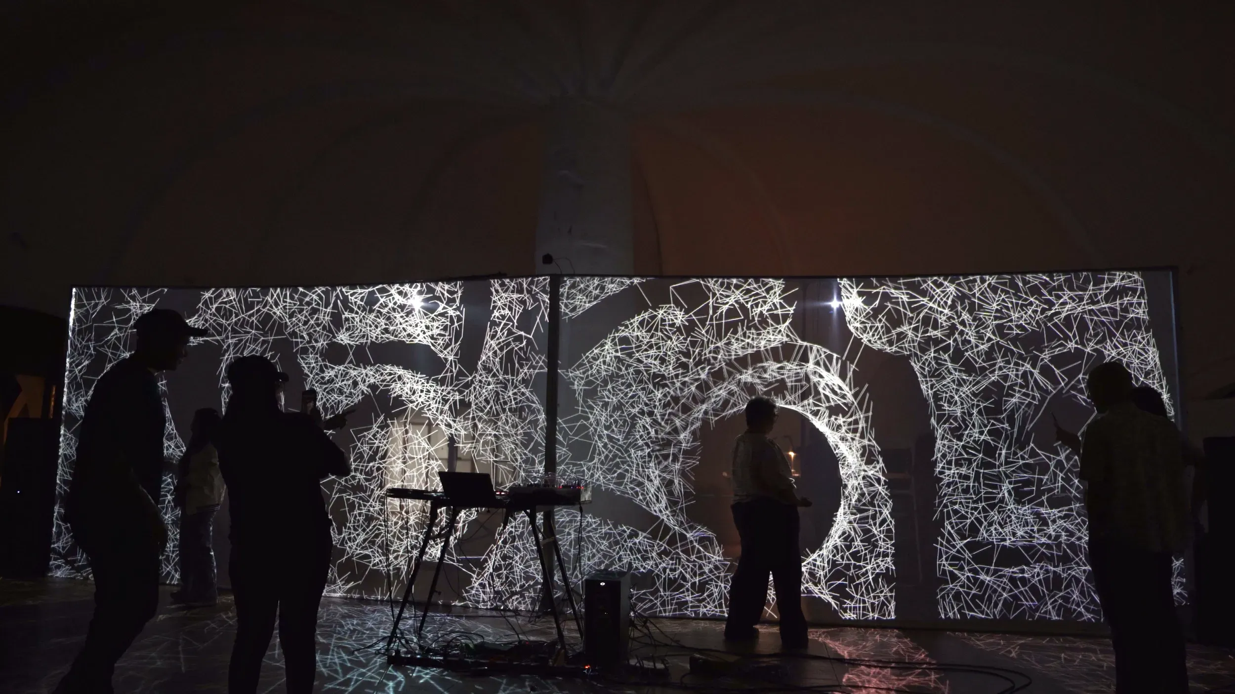 Audience interacting with generative typographies